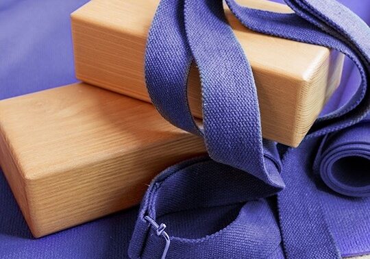 Props for yoga including blocks and straps.