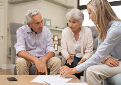Older couple talking to life coach about end of life planning